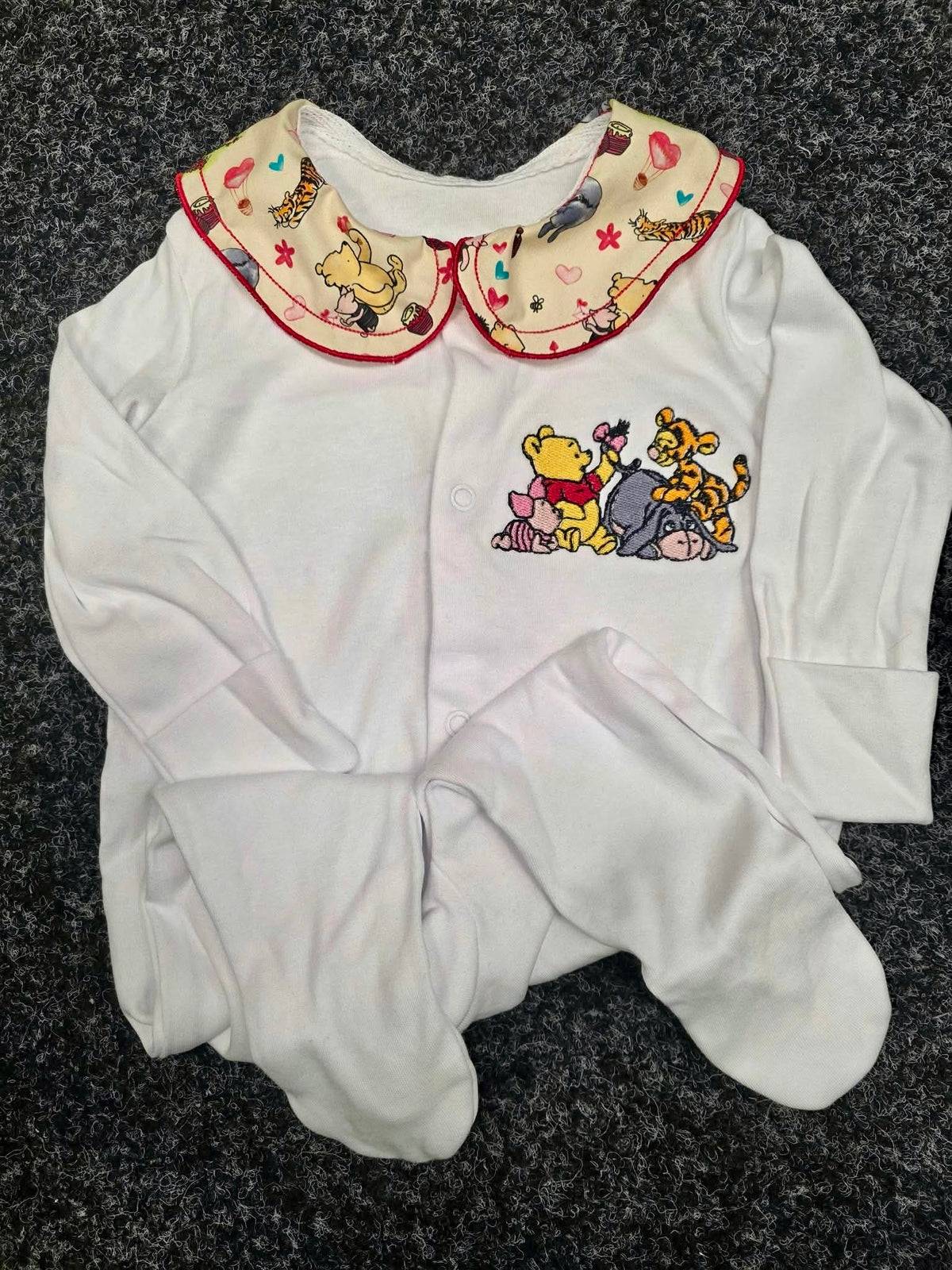 Embroidered baby sleepsuit