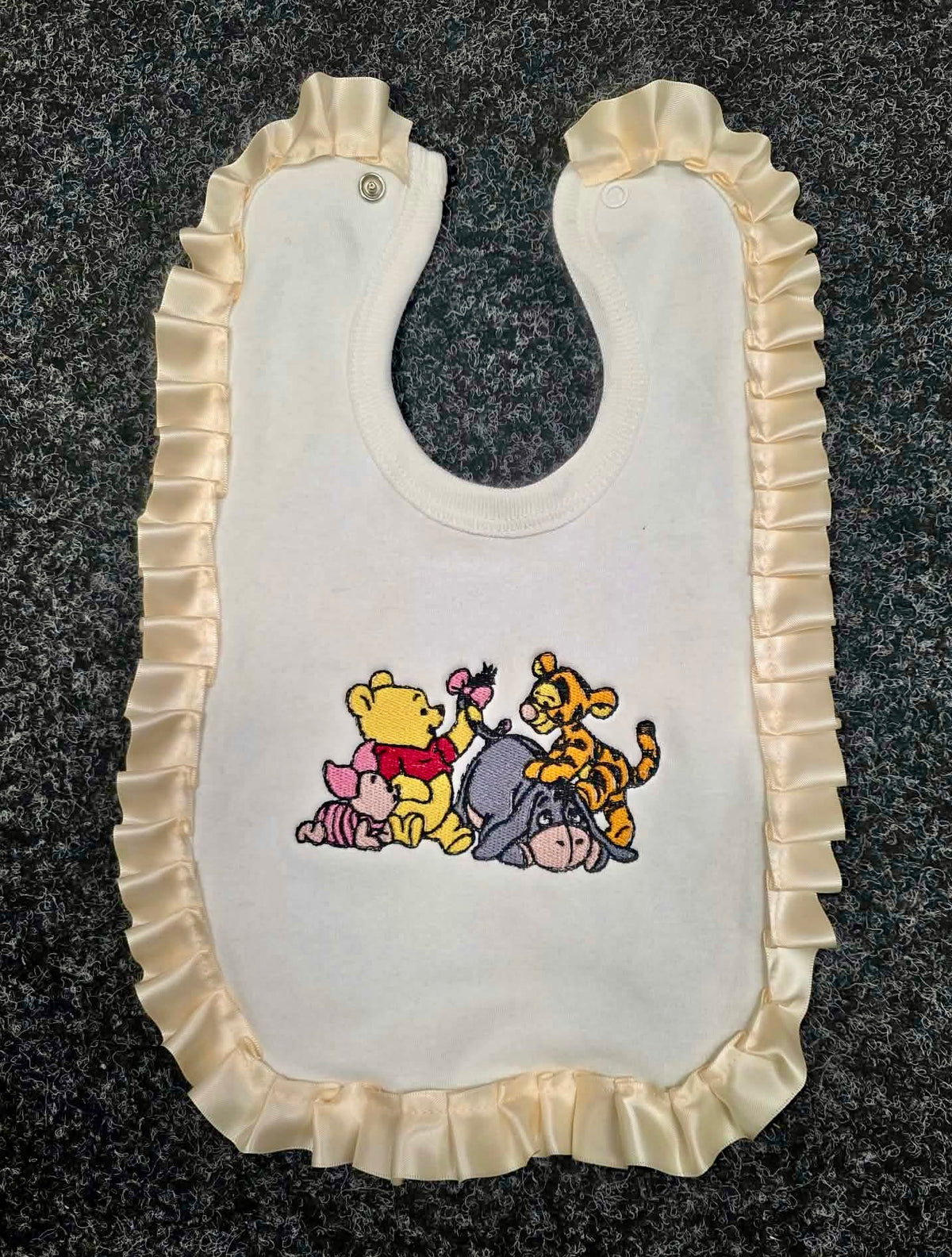 Frilled baby bib