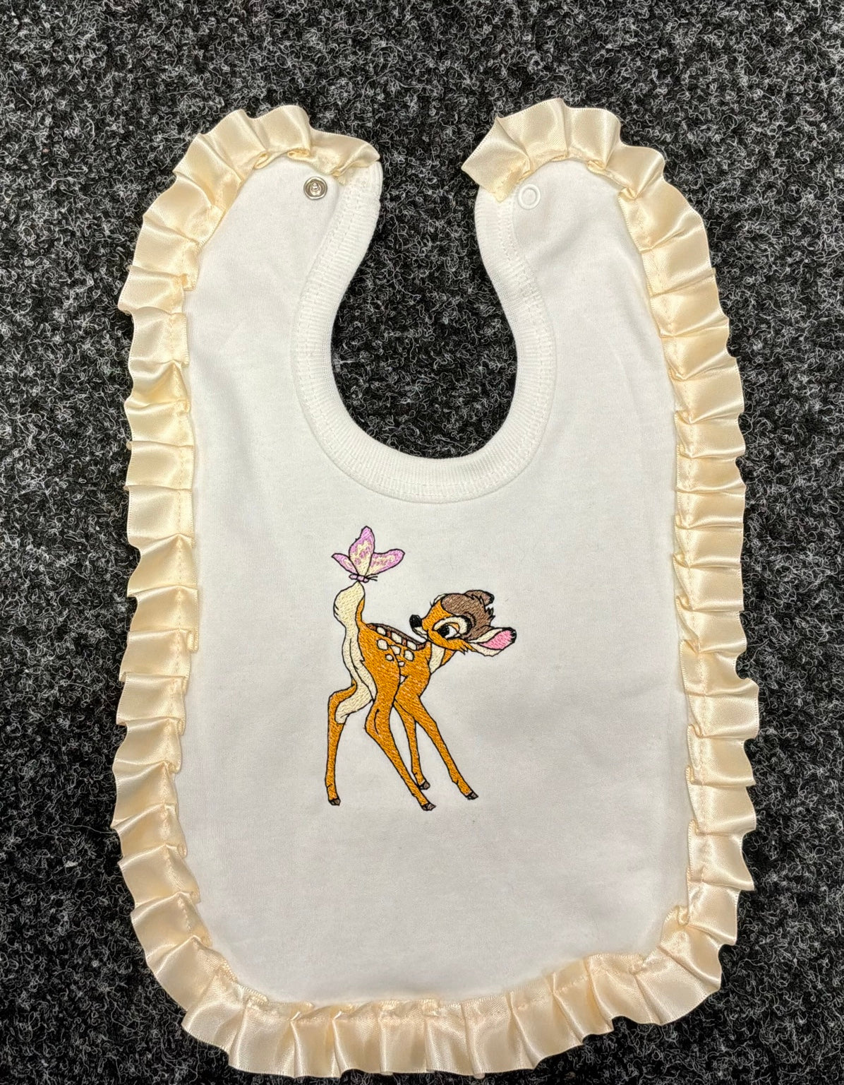 Matching deer bib with satin ruffle trim