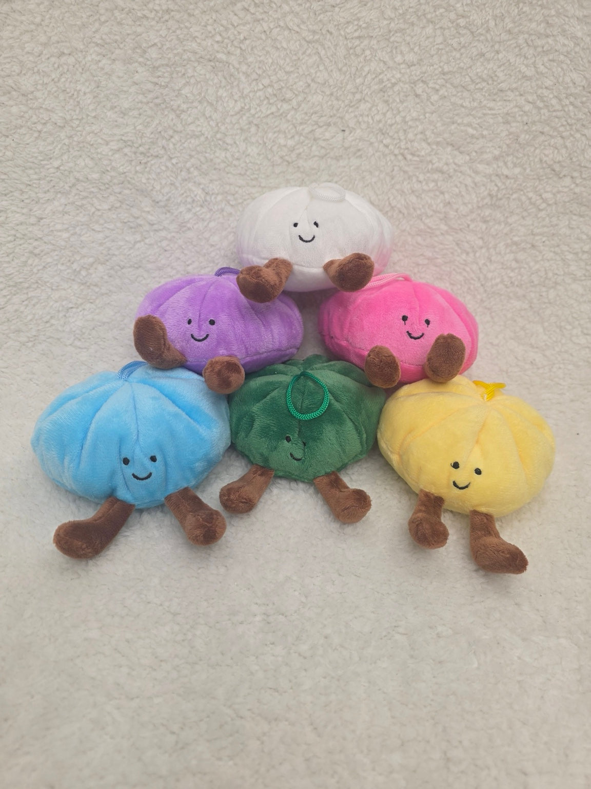 Dumpling plush toys in white pink purple blue green and yellow