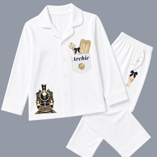 Personalised white Christmas pyjamas with navy and gold train design